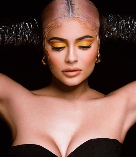Kylie Jenner Puts On Busty Display As She Slips Into A Strapless Top