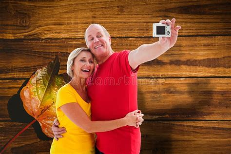 Composite Image Of Happy Mature Couple Taking A Selfie Together Stock Image Image Of Male