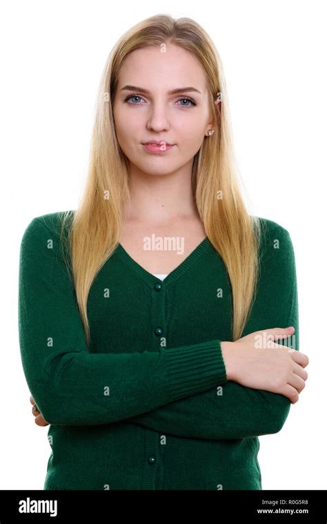 Studio Shot Of Young Beautiful Teenage Girl With Arms Crossed Stock