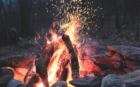 Download Wallpaper 3840x2400 Bonfire Fire Sparks Stones Firewood