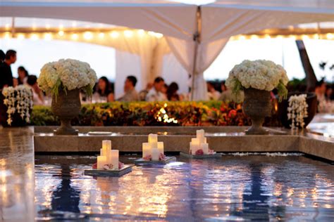 Peacock wedding pool decor floating candles. Gorgeous Pool Decorations For Weddings - Belle The Magazine