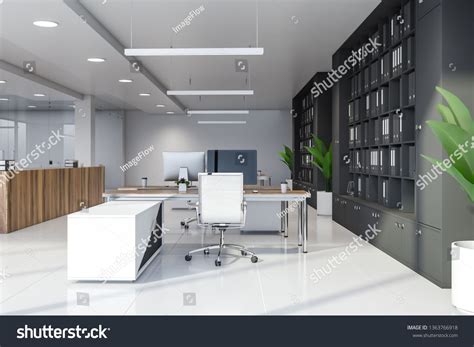Modern Manager Office Interior With White And Glass Walls Tiled Floor