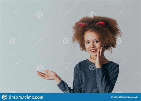 Headshot Portrait Sweet Little Girl With Curly Hair Smiling Looking At