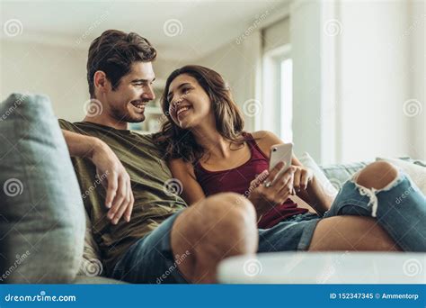 Loving Couple Relaxing On Sofa Stock Image Image Of Casuals Females 152347345