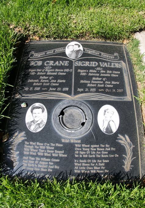 A Plaque In The Grass With Pictures On It