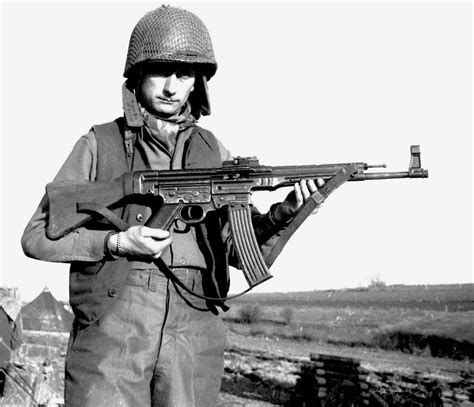 American Soldier Of Ww2 Holding Captured Mp 44 Assault Rifle Ww2 Photos