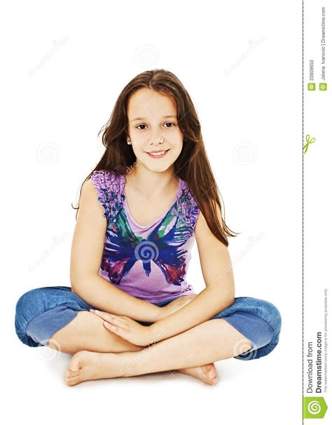 Pretty Little Girl Sitting On The Floor In Jeans Stock