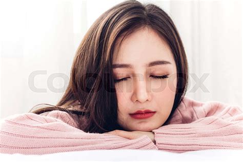 Portrait Of Sleeping Young Asia Woman Enjoy And Relax Lying On The Bed