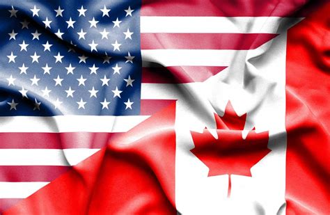 Waving Flag Of Canada And Usa Berardi Immigration Law