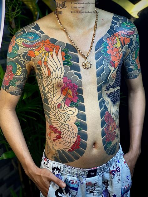 A Man With Tattoos On His Body And Chest
