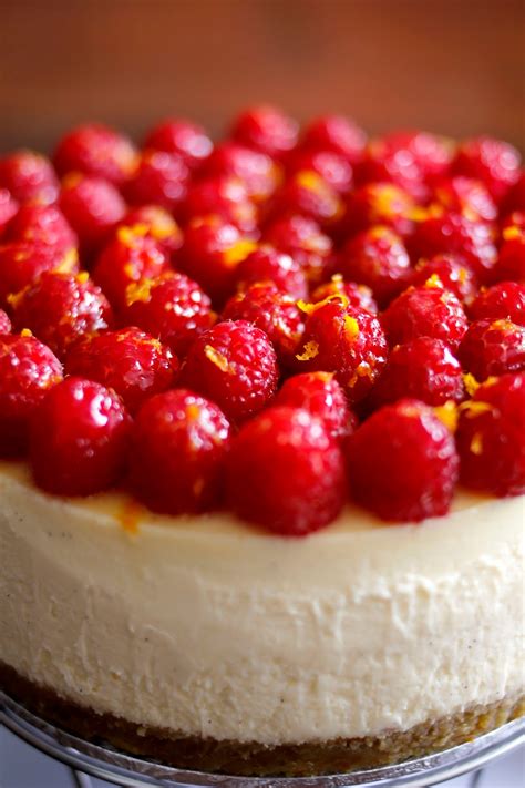 Top each cheesecake with 1 1/2 tablespoons berry syrup, 3 raspberries, and mint leaves, if desired. In Cookie Haven: Orange Raspberry Cheesecake