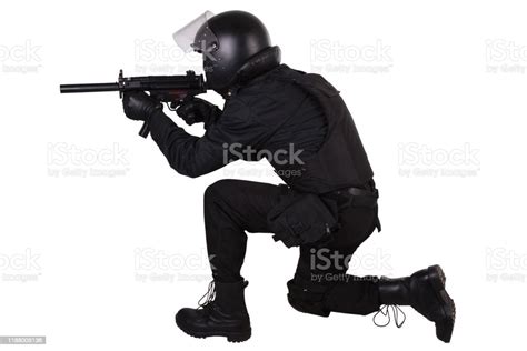 Police Special Forces Officer With Submachine Gun In Black Uniform