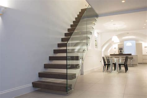 This contemporary stair railing consists of pine wood, clear thin glass, and a marble base. Contemporary staircases, glass staircase London, helical ...