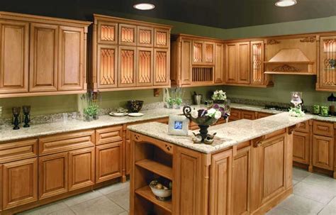 If you'd prefer to soften the look, consider choosing two cabinetry colors instead, placing the green shade on the base cabinets. light green kitchen walls with oak cabinets - Google ...