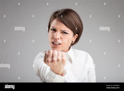 Angry Woman Shaking Her Fist At The Camera Stock Photo Alamy