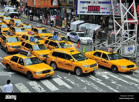 Rush Hour Taxis In Times Square Midtown Manhattan New York Usa