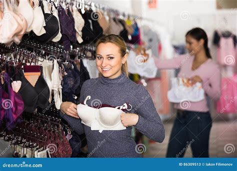 Woman Selecting Bra In Lingerie Store Stock Image Image Of Lingerie Looking
