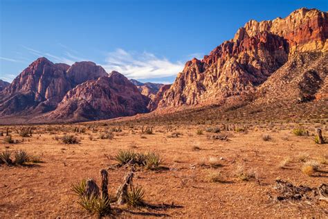 The Rugged Arid Landscape Of Nevadas Red Rock Canyon Stretches Into The