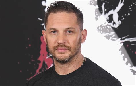 Tom Hardy collects CBE from Buckingham Palace