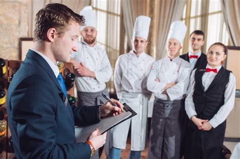 Premium Photo Restaurant Manager And His Staff In Kitchen