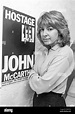 HARPENDEN - ENGLAND. Jill Morrell poses next to a poster of John ...