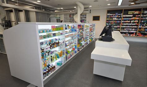 Her hospital pharmacy uses a large automated machine called a(n). Pharmacy Counter Design & Display | Dispensary and Over ...