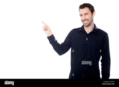 Handsome Young Guy Pointing At Something Stock Photo Alamy