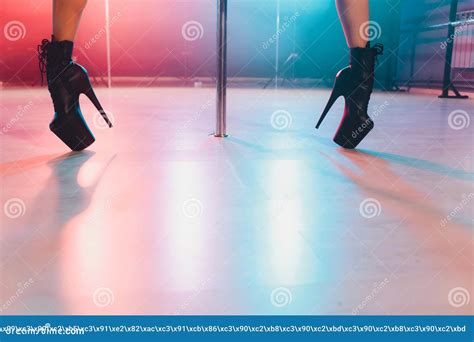 Young Striptease Dancer Moving In High Heels Shoes On Stage In Strip