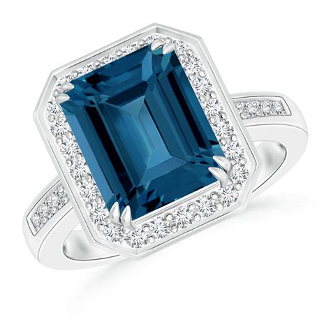 Emerald Cut London Blue Topaz Ring With Diamond Halo Angara