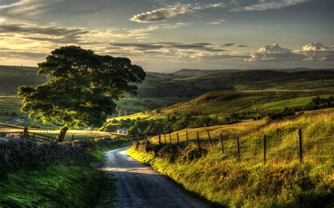 Sunset Villages Road Field Grass Hill Fence Trees Clouds Green