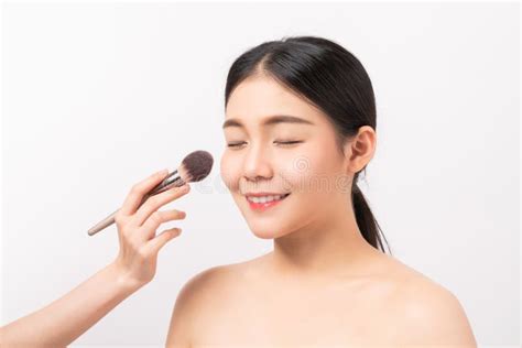 Beauty Shot Of Woman With Hand Holding Makeup Powder Brush On Face Cosmetic Of Perfect Skin