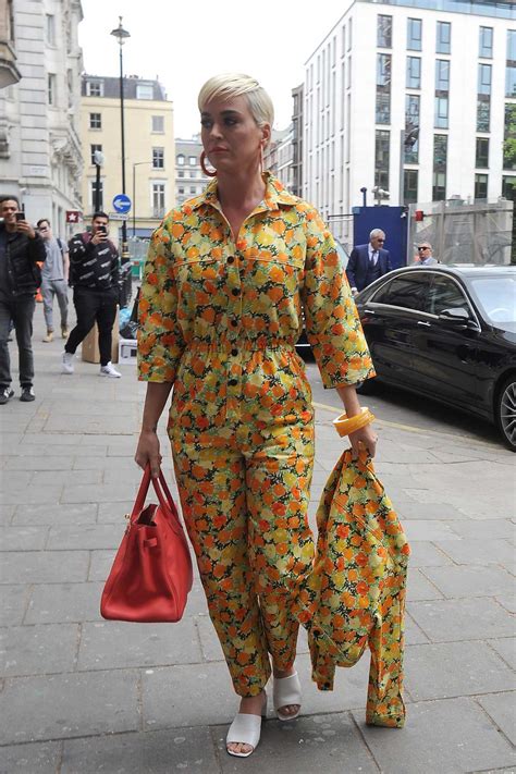 Katy Perry Wears A Bright Yellow Floral Print Jumpsuit As She Steps Out In London Uk 0105195