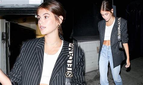 Kaia Gerber Flashes Her Abs In Crop Top And Smart Blazer As She