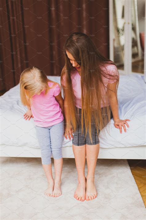 Young Mother And Daughter Sitting On People Images ~ Creative Market