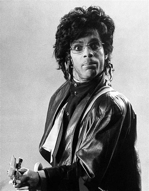 Prince Performs On Stage Wearing Glasses And Looking To Camera At Prince Wearing Glasses