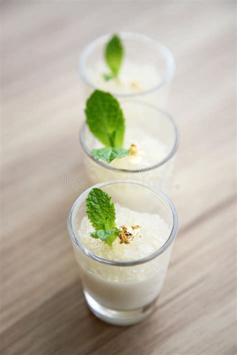 Milk Pudding With Fish Maws And Mint Leaf In Glasses Stock Image