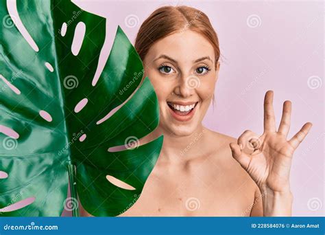 Young Irish Woman Standing Topless Showing Skin Doing Ok Sign With