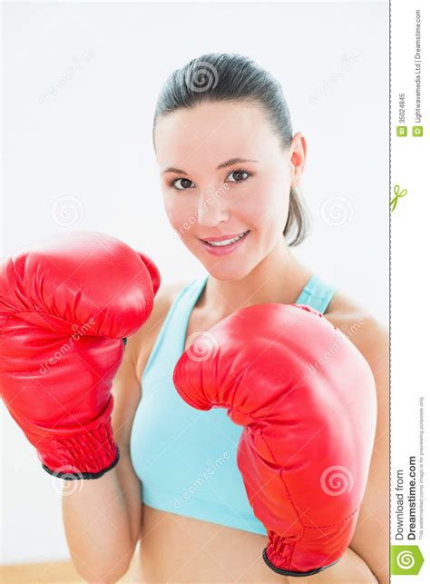 Close Up Of A Beautiful Young Woman In Red Boxing Gloves Stock Image