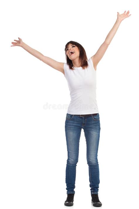 Happy Young Woman Is Standing With Arms Outstretched And Shouting Stock