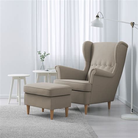 I'm 6 feet tall and a lot of chairs and couches are too low. STRANDMON Wing chair - Skiftebo light beige - IKEA