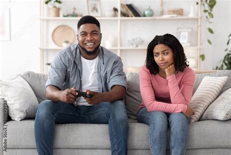 Boring Date Excited Black Guy Playing Video Games And Ignoring Girlfriend Next To Him Stock