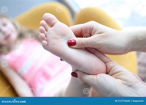 Podiatrist Holding Child Leg In Massage Parlor Closeup Stock Photo