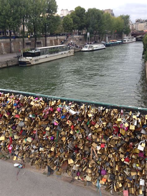 Cruises on river in paris. Seine River in Paris showing bridge with locks that will ...
