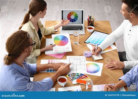 Professional Team Of Interior Designers Working Stock Photo Image Of