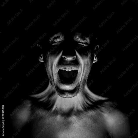 Stylish Dark Portrait Of Screaming Adult Caucasian Man Fear Concept