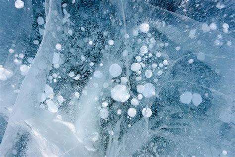 Beautiful Ice Of Lake Baikal With Abstract Cracks And Frozen Air