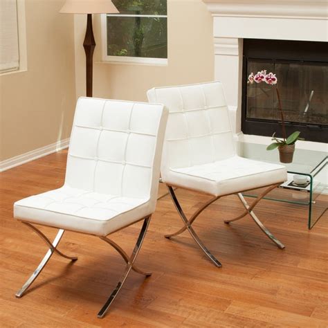 Our dining room chairs come in different materials, styles, shapes and colours to accommodate your tables and other dining room furniture. Milania White Leather Dining Chairs (Set of 2) by ...
