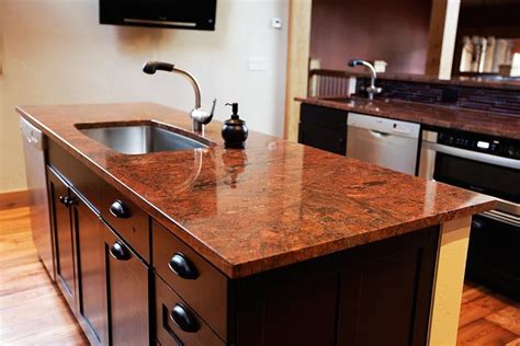 Green herbs on kitchen countertop. Most Popular Granite Colors for Countertops (White, Red ...