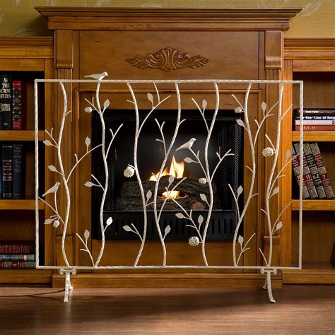 Interior Artistic Decorative Fireplace Screen With Light Metal Carvings On Laminate Floor