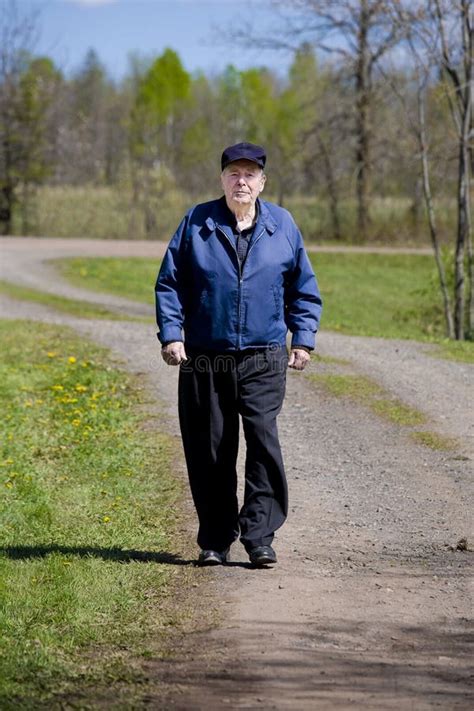 Elderly Man Walking On Road Stock Photo Image Of Walking Handsome